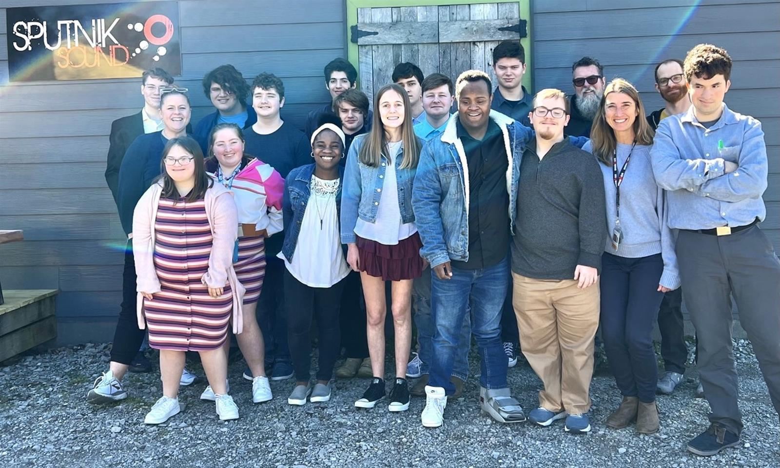A group of students takes a photo